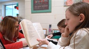 student reading book 